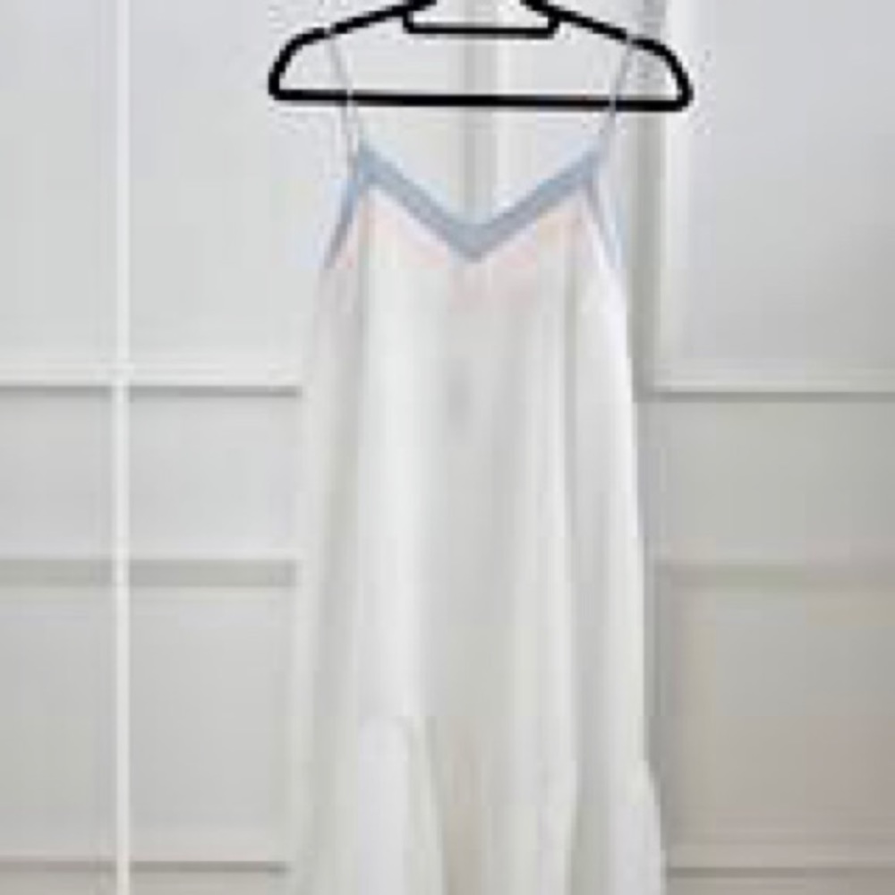 White summer dress with pink and blue details